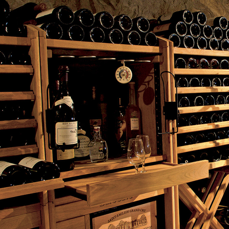 Wine wall created with sliding wine racks for easy access to your wine cases