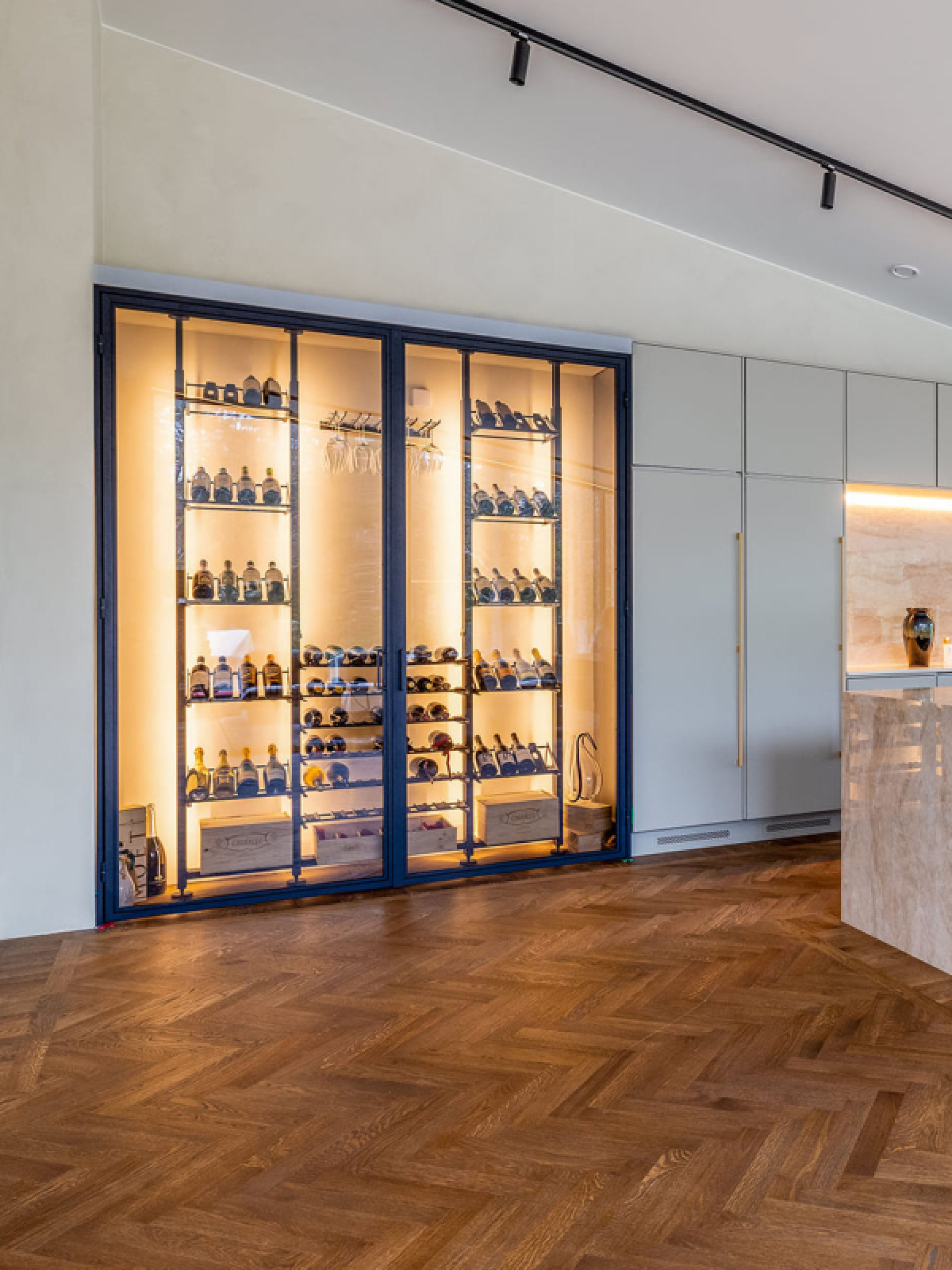 Example of a metal wine storage space embedded in a wall  in a luxury interior in Denmark