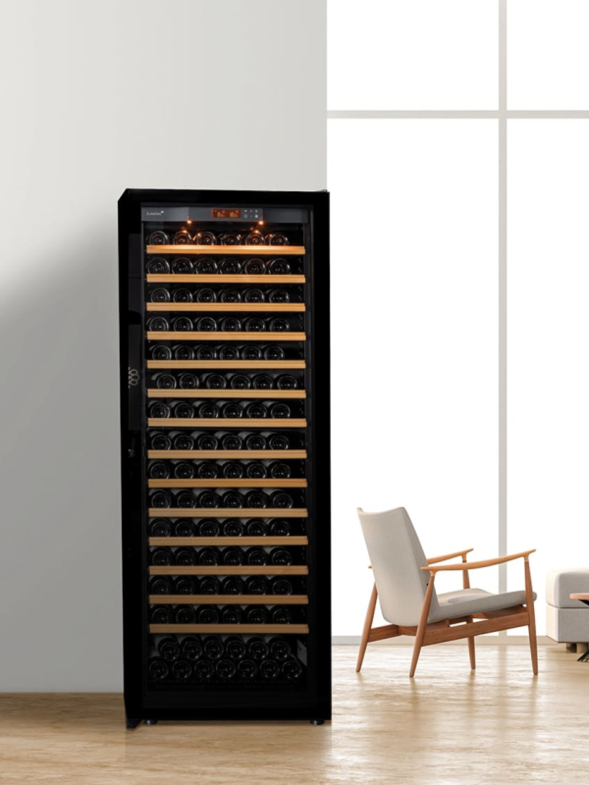 Air-conditioned wine cabinet installed in a living room for wines at the right temperature always available for a good improvised meal. - Pure EuroCave