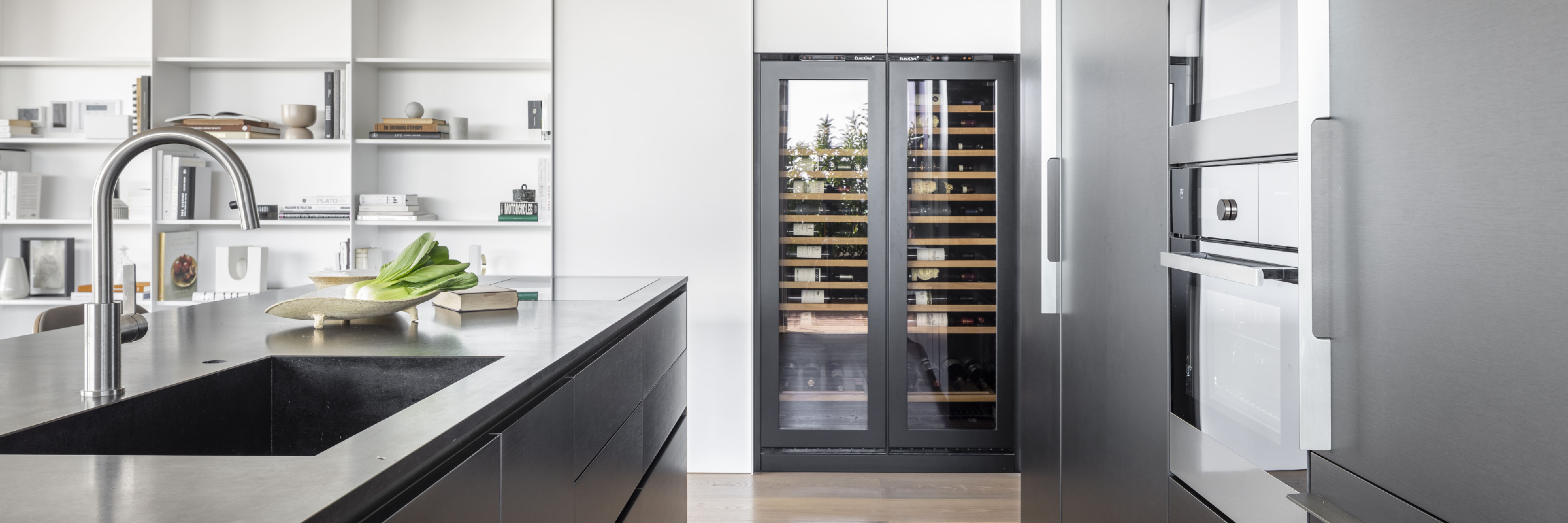 Double wine cooler integrated in fitted kitchen wall unit - technical glass door with adaptation of unit fronts. Double wine cooler integrated in fitted kitchen wall unit - technical glass door with adaptation of unit fronts.