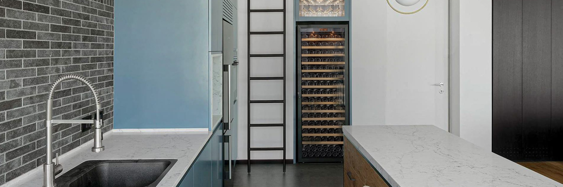 Built-in wine fridge in the kitchen for a large capacity of bottles kept at serving temperature. - EuroCave Pure range
