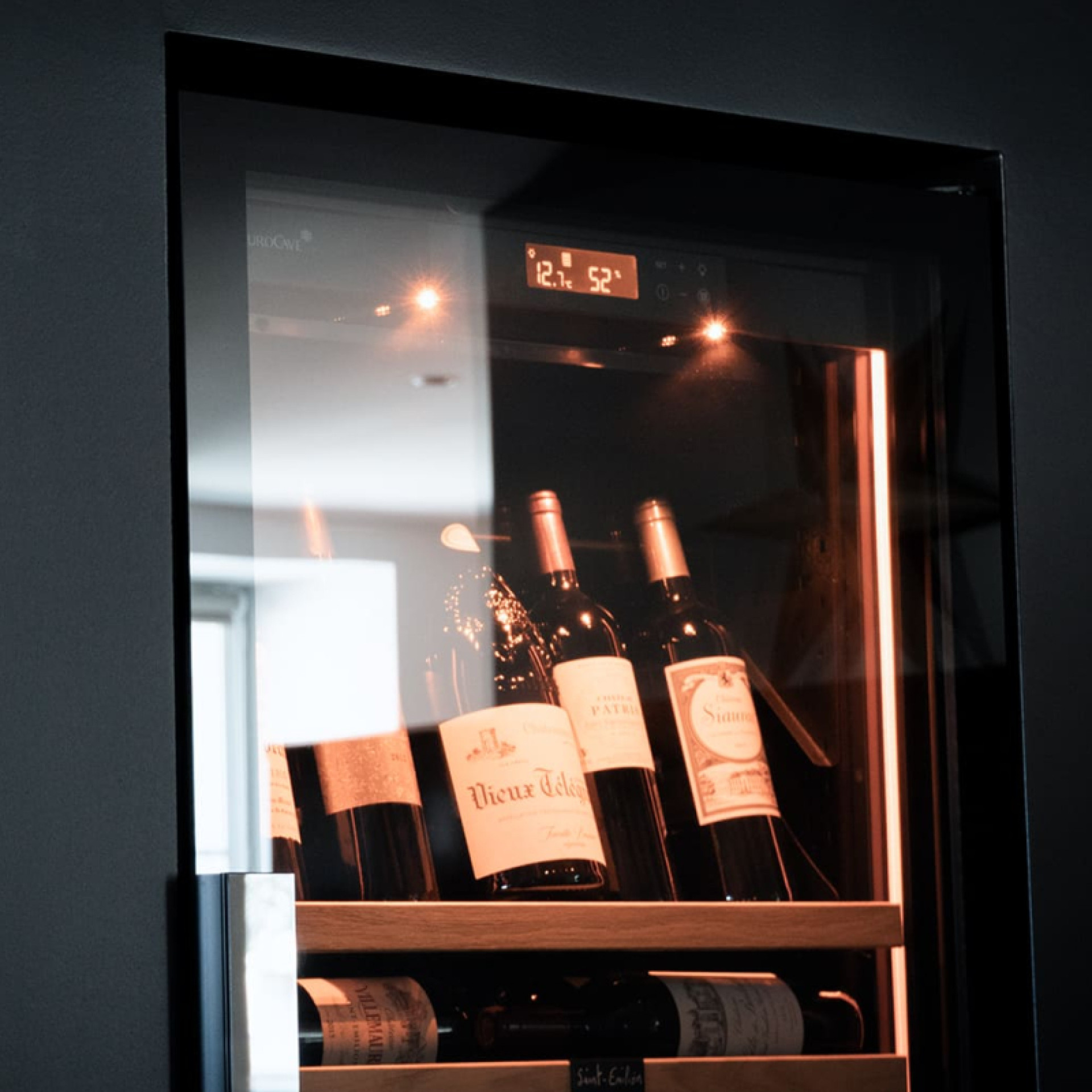 A fully glazed frameless door for clean lines and an unobstructed view of your finest bottles of wine.