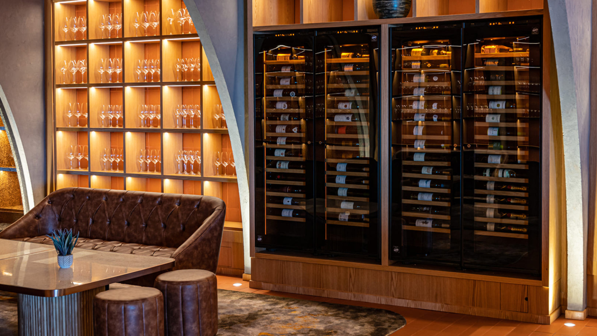Wine wall with four large integrated wine coolers - Scenography of the wine offer in a design restaurant. Inspiration EuroCave Wine wall with four large integrated wine coolers - Scenography of the wine offer in a design restaurant. Inspiration EuroCave