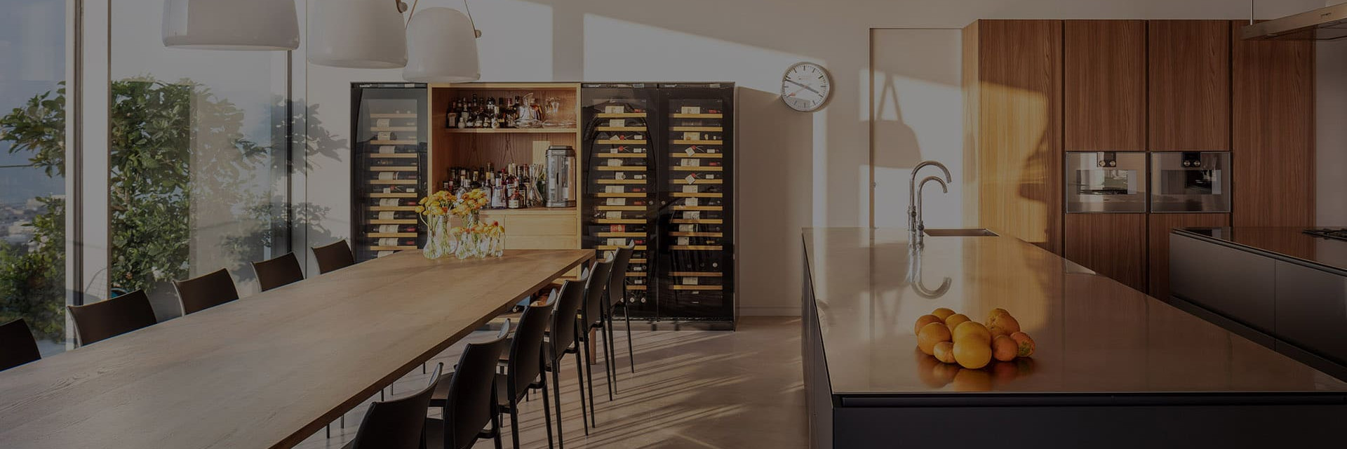 Interior architecture - Several wine cellars integrated into a custom piece of furniture in an open kitchen creating a beautiful reception space. How to combine aging and service.  Inspiration EuroCave