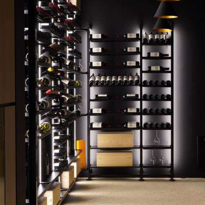 Beautiful display of wines with this designer black metal storage and its overhead shelves with individual bottle holders.