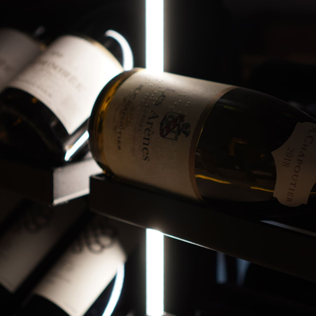 Wine storage shelves with integrated lighting (optional) and numerous possibilities for displaying bottles. Wine storage shelves with integrated lighting (optional) and numerous possibilities for displaying bottles.
