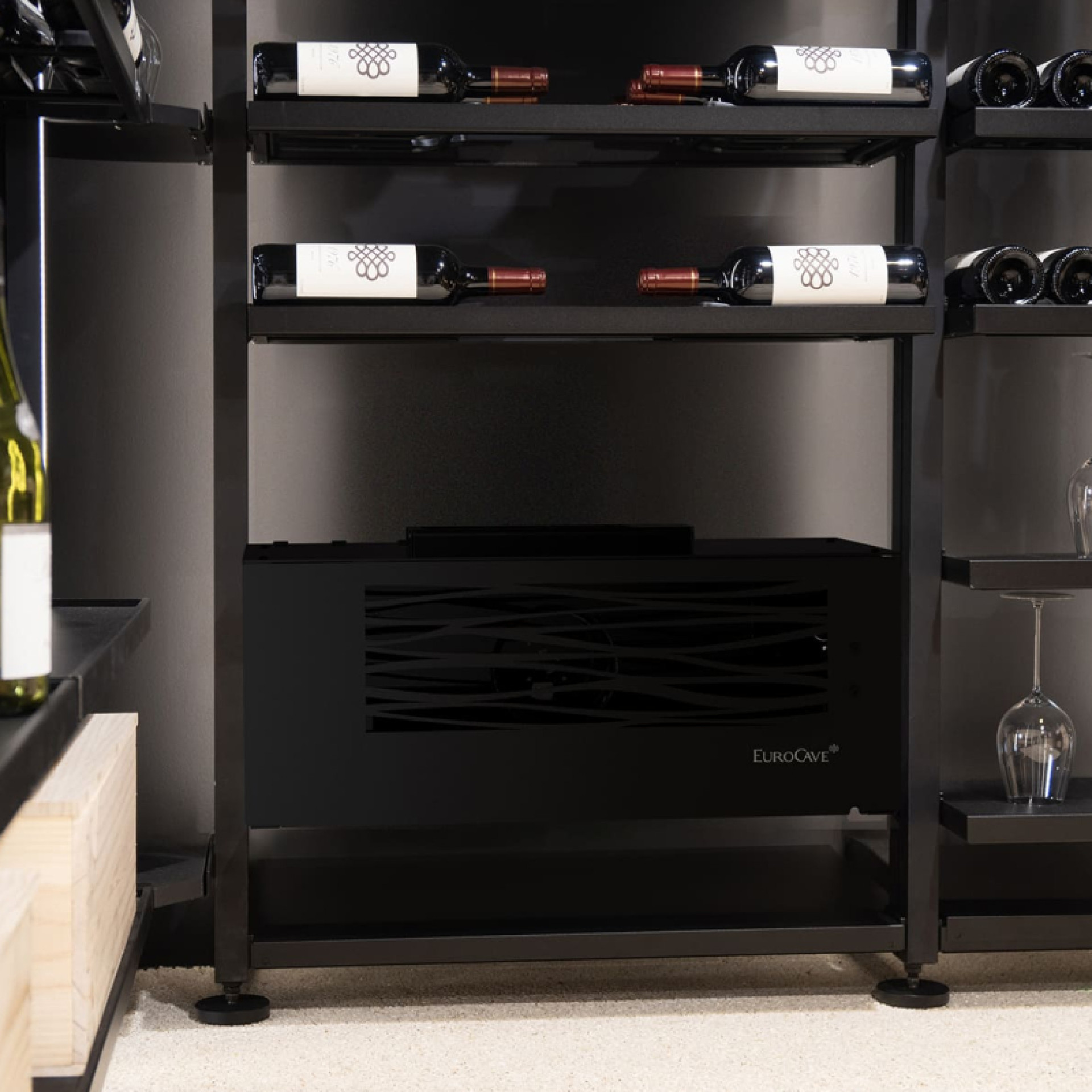 Small wine cellar air conditioner in glossy black design, water split system. Compact for easy installation attached to the wall or placed on the floor.