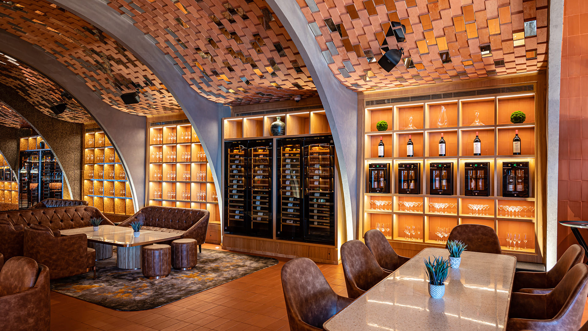 Breathtaking restaurant scenography with service wine coolers and wine bars integrated into custom-designed furniture. Exhibition bar to highlight the wine offer and generate customer interest.
