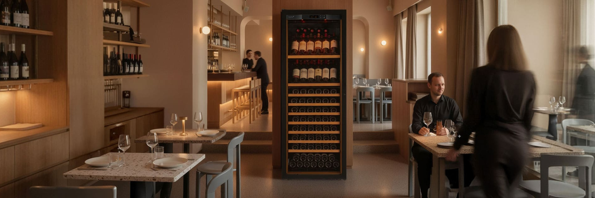 Service wine fridge with bottle display and integrated lighting in a restaurant dining room